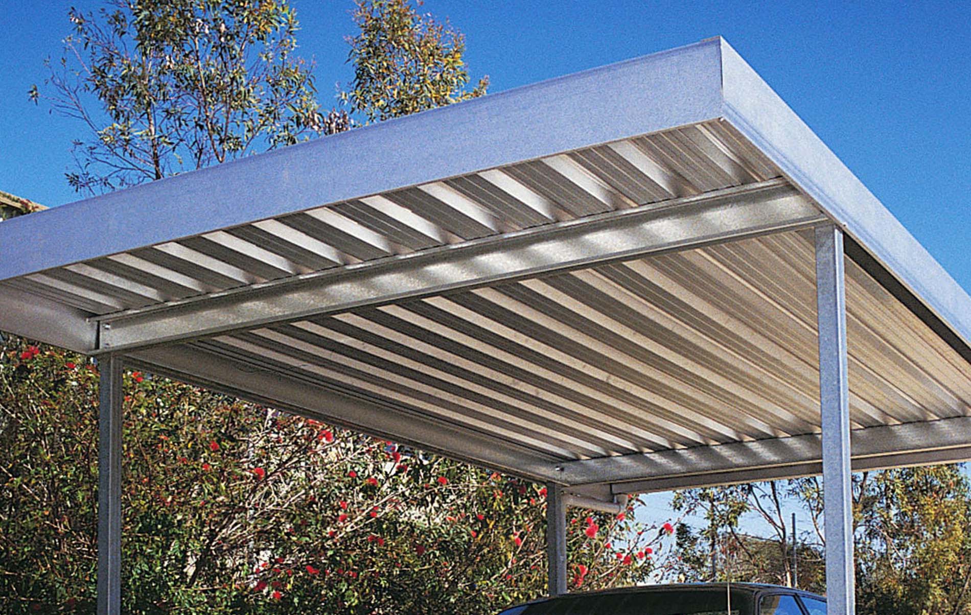 Architectural flat roof shelter with subtle lighting accents for driveway