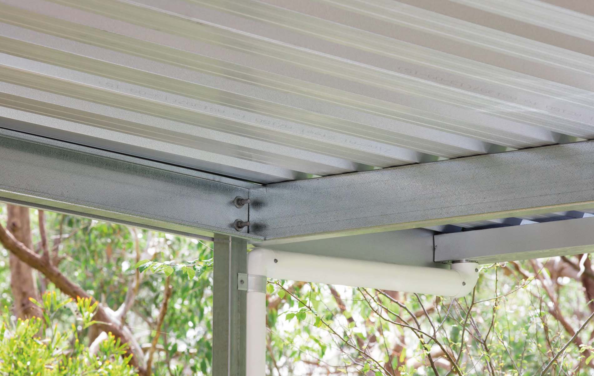 Modern flat roof carport with dark timber posts and sleek metal roofing