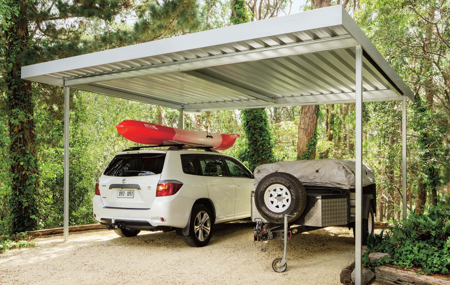Modern carport with a sleek flat roof design, providing shelter for vehicles