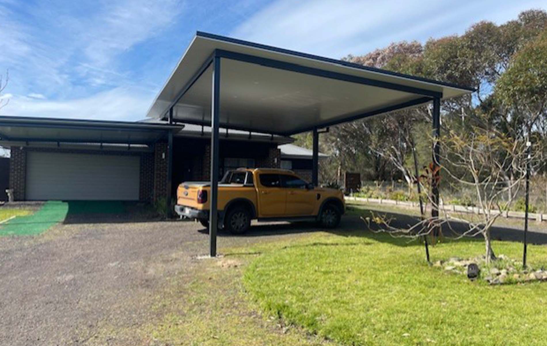 Flat roof carport structure featuring integrated lights and clean design by Modern Solutions