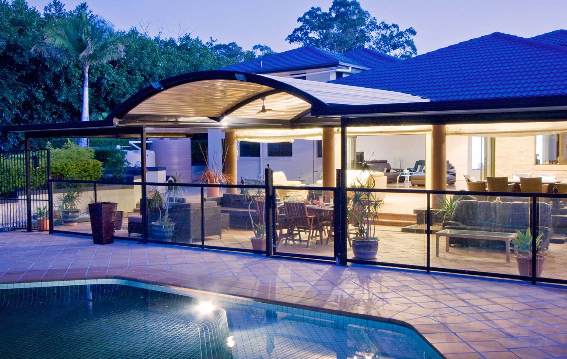 Curved roof patio illuminated with outdoor lighting in Melbourne backyard