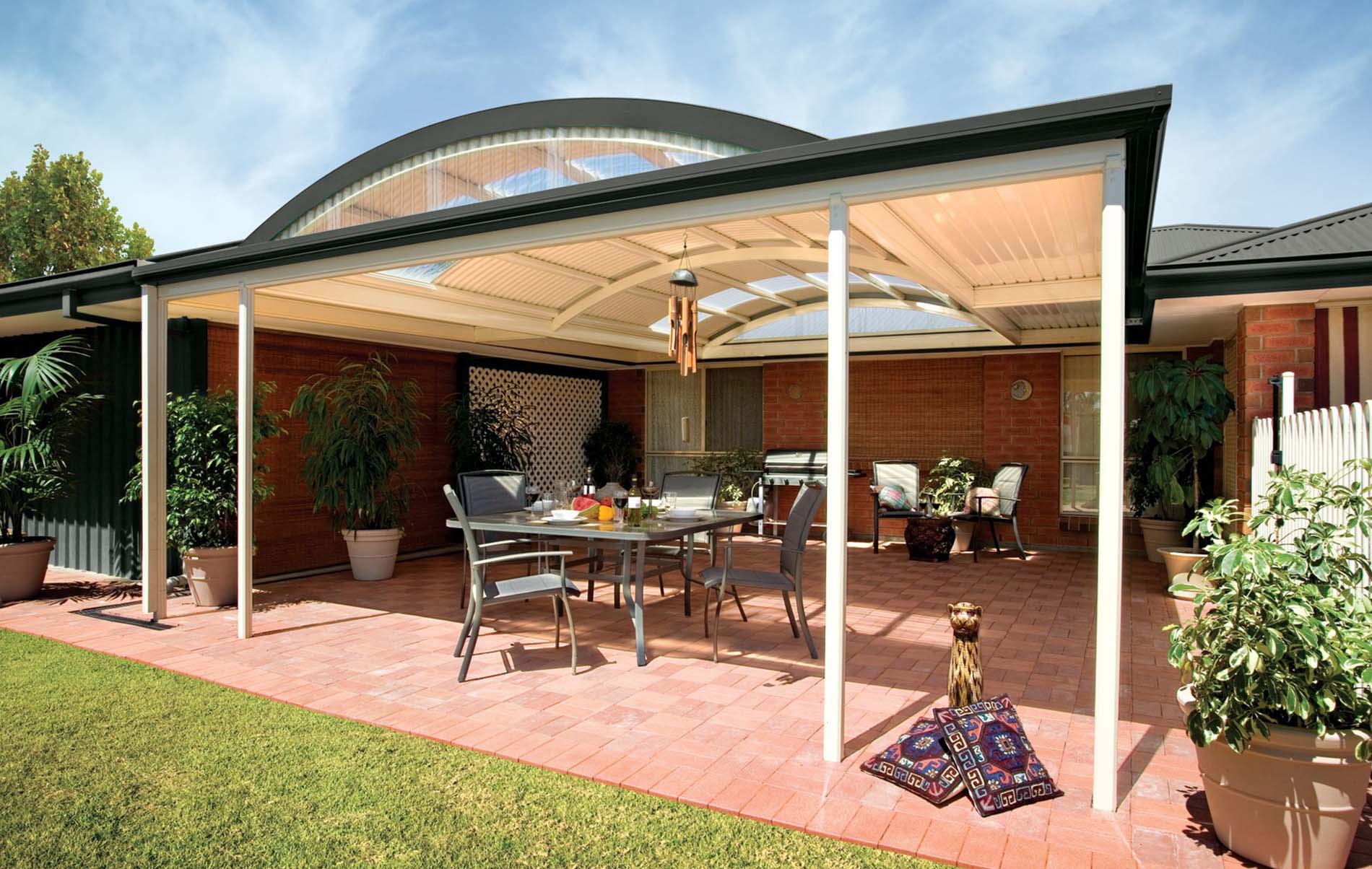 Modern curved patio with integrated outdoor lighting and garden landscaping