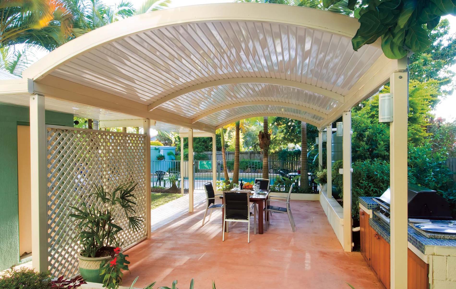 Elegant curved verandah patio with timber beams and ceiling fan