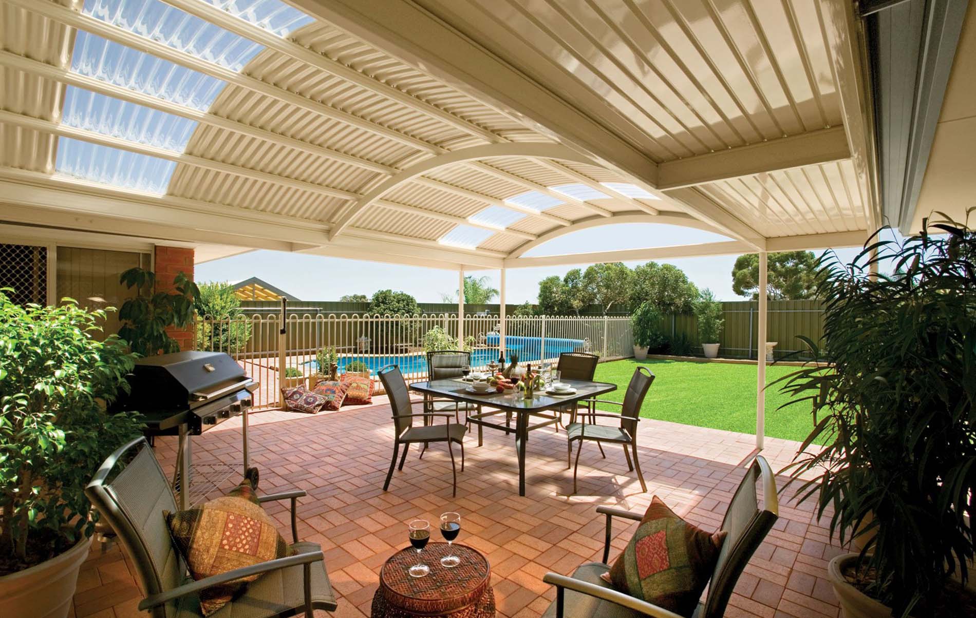 Freestanding curved patio with dual posts and steel roofing
