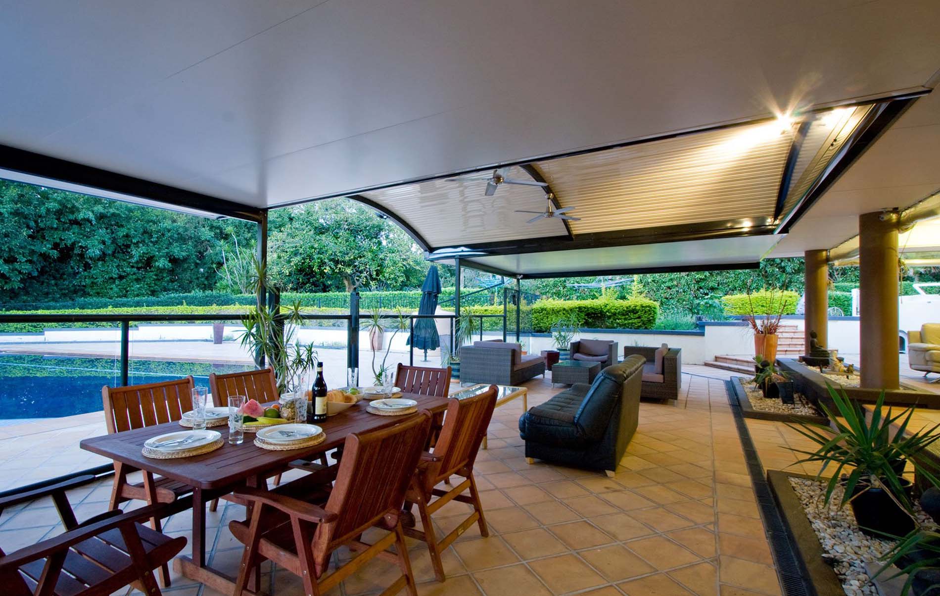 Freestanding curved patio with timber-look posts and Colorbond roofing
