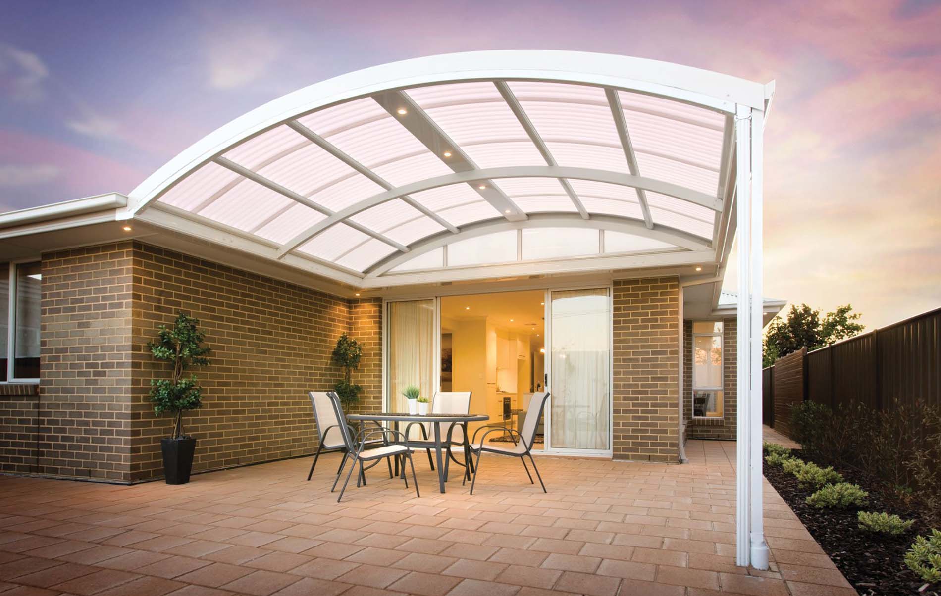 Backyard transformation with modern curved patio installation
