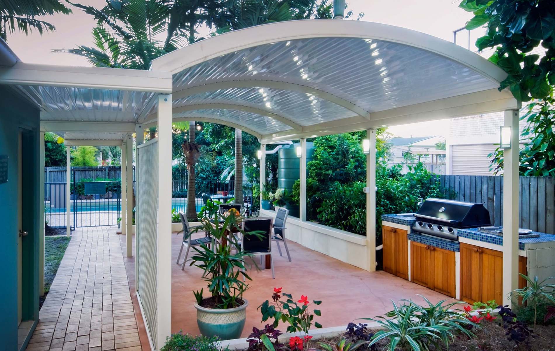 Modern curved patio with translucent polycarbonate roofing panels