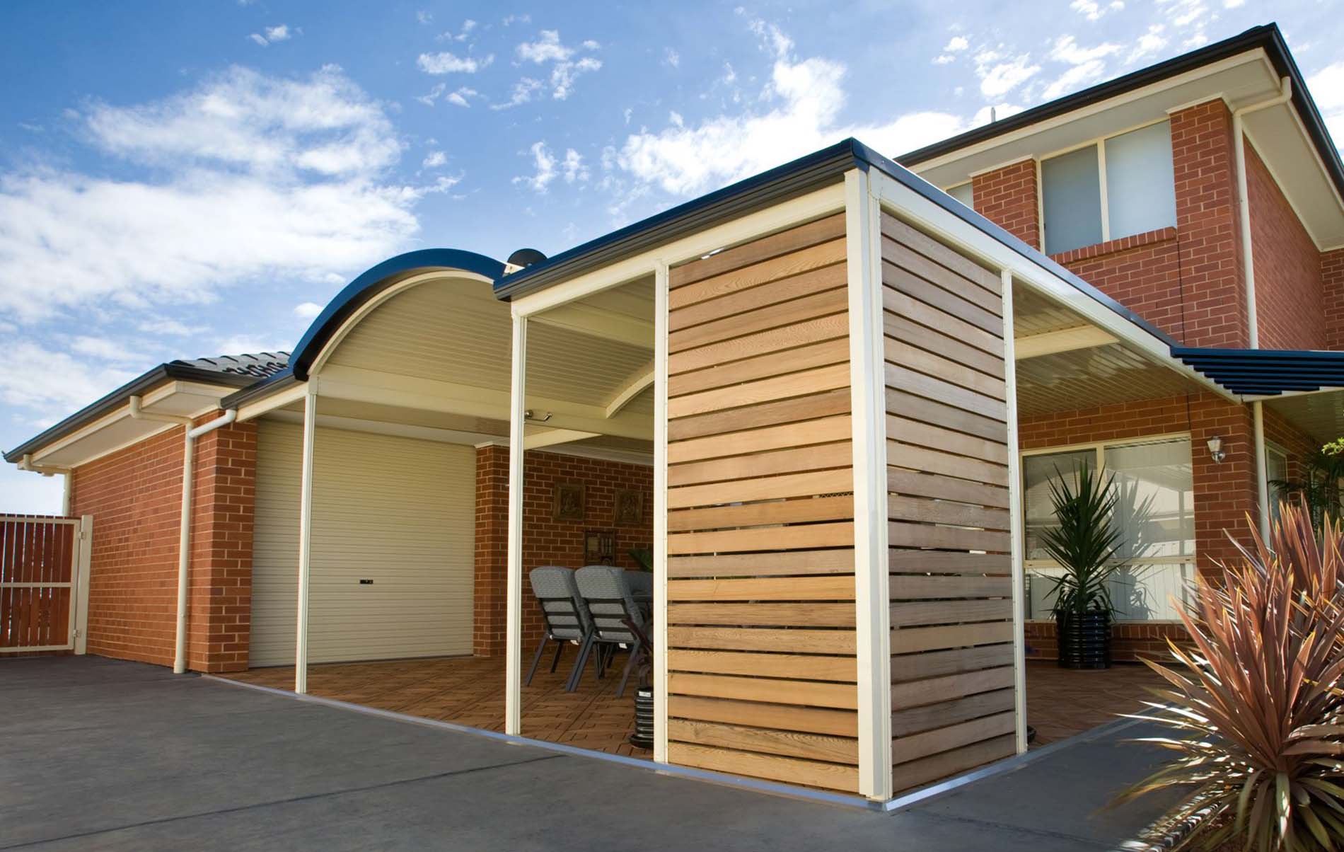 Curved patio with corrugated steel roofing and integrated lighting
