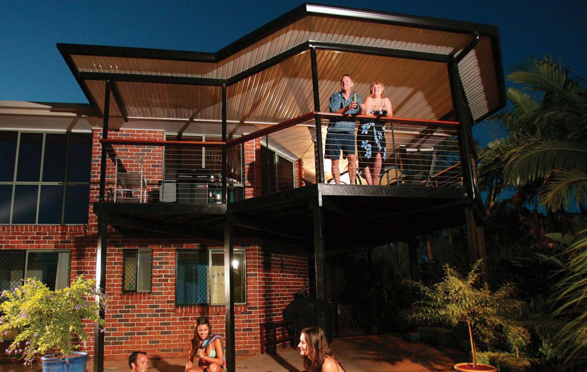Flat roof patio with integrated lighting and timber-look posts