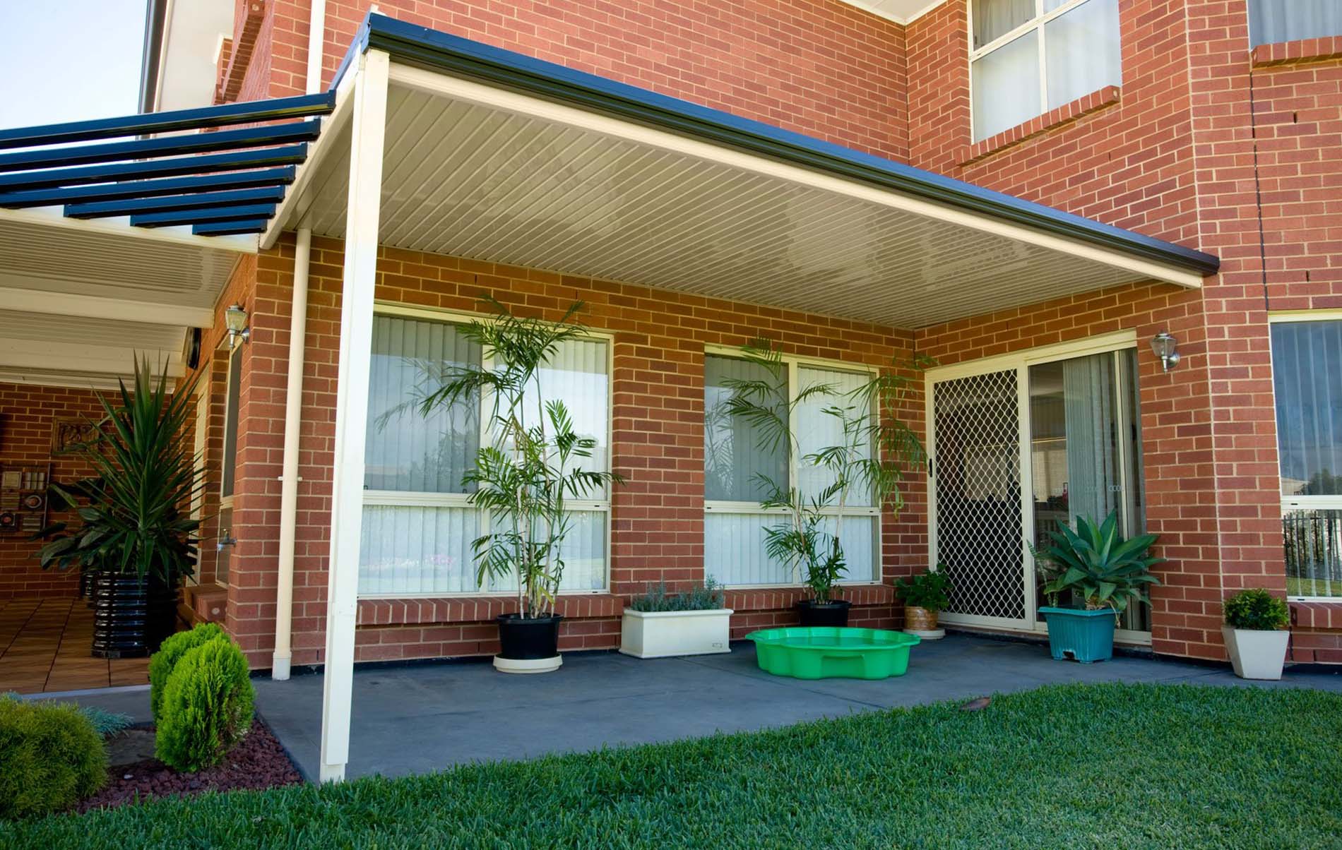 Elegant flat patio with concealed guttering and timber-look aluminium posts