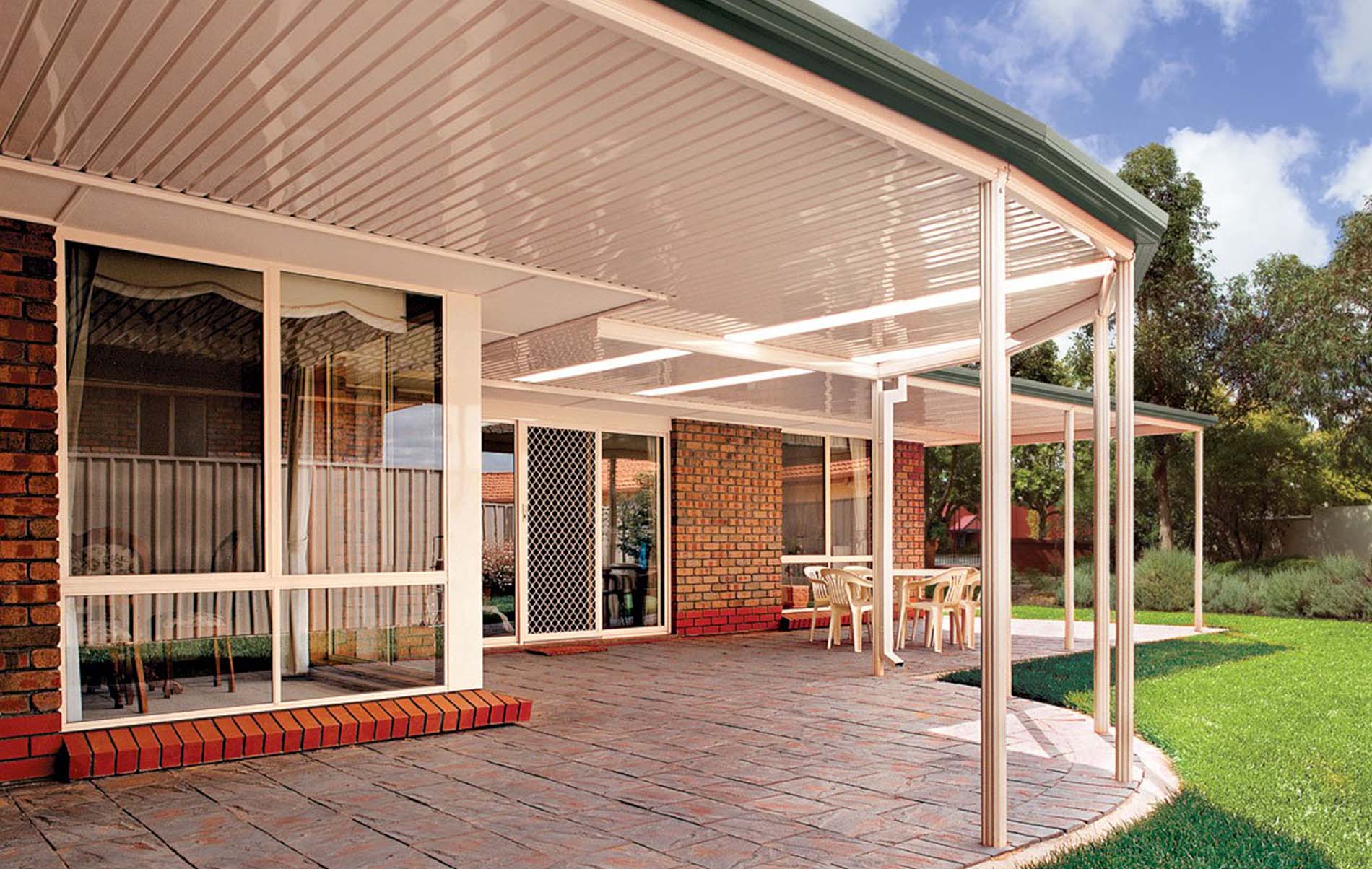 Attached flat roof patio extending from home with seamless integration