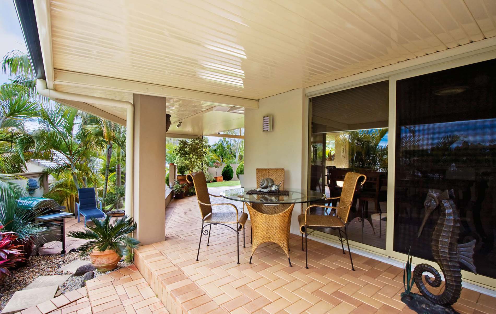 Elegant flat patio with concealed guttering and timber-look aluminium posts