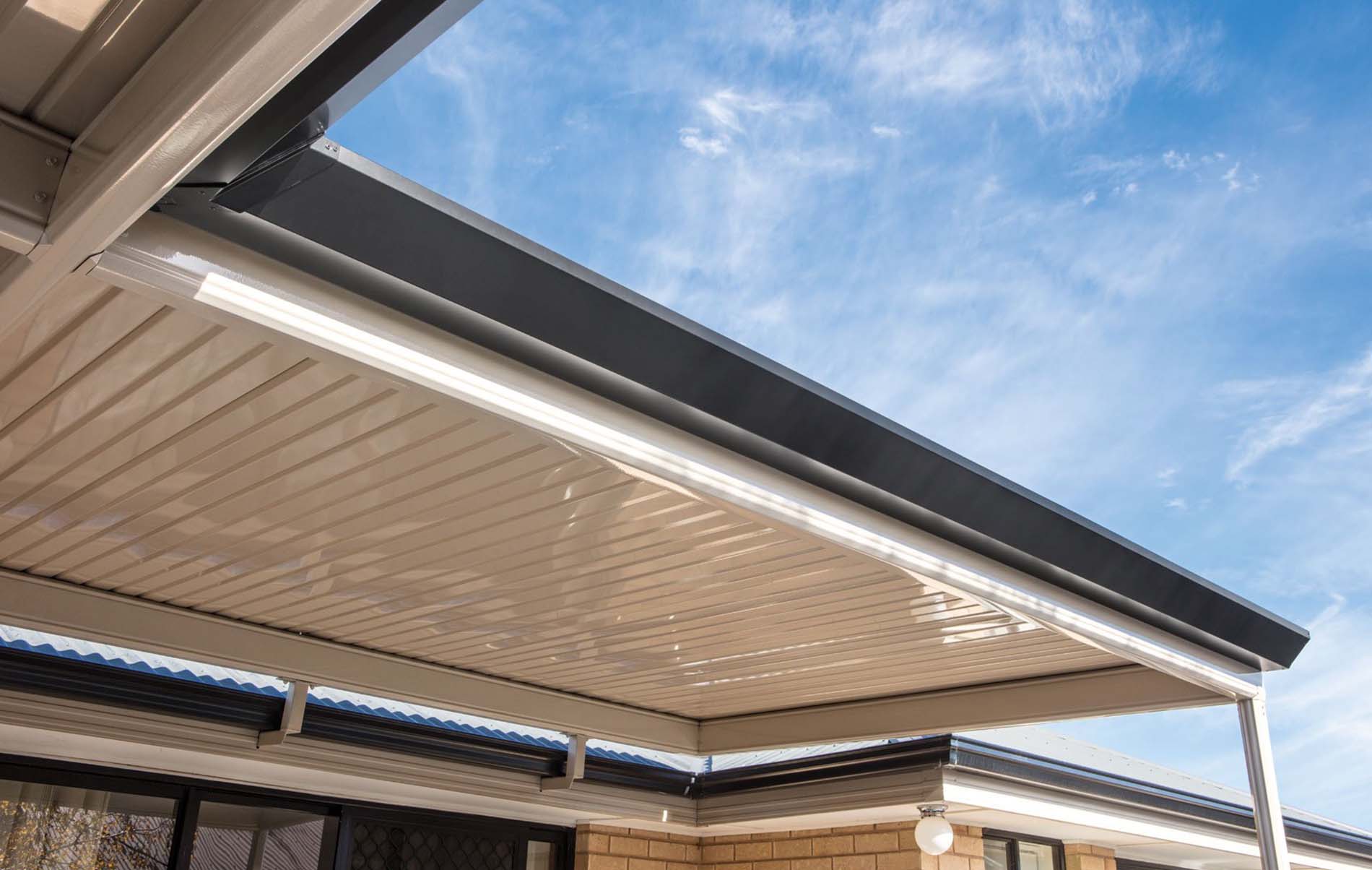 Contemporary flat roof patio with integrated lighting and timber-look posts
