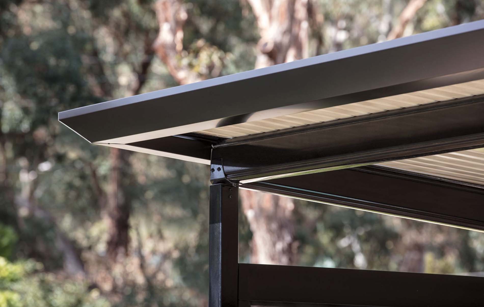 Contemporary flat roof patio with integrated lighting and timber-look posts