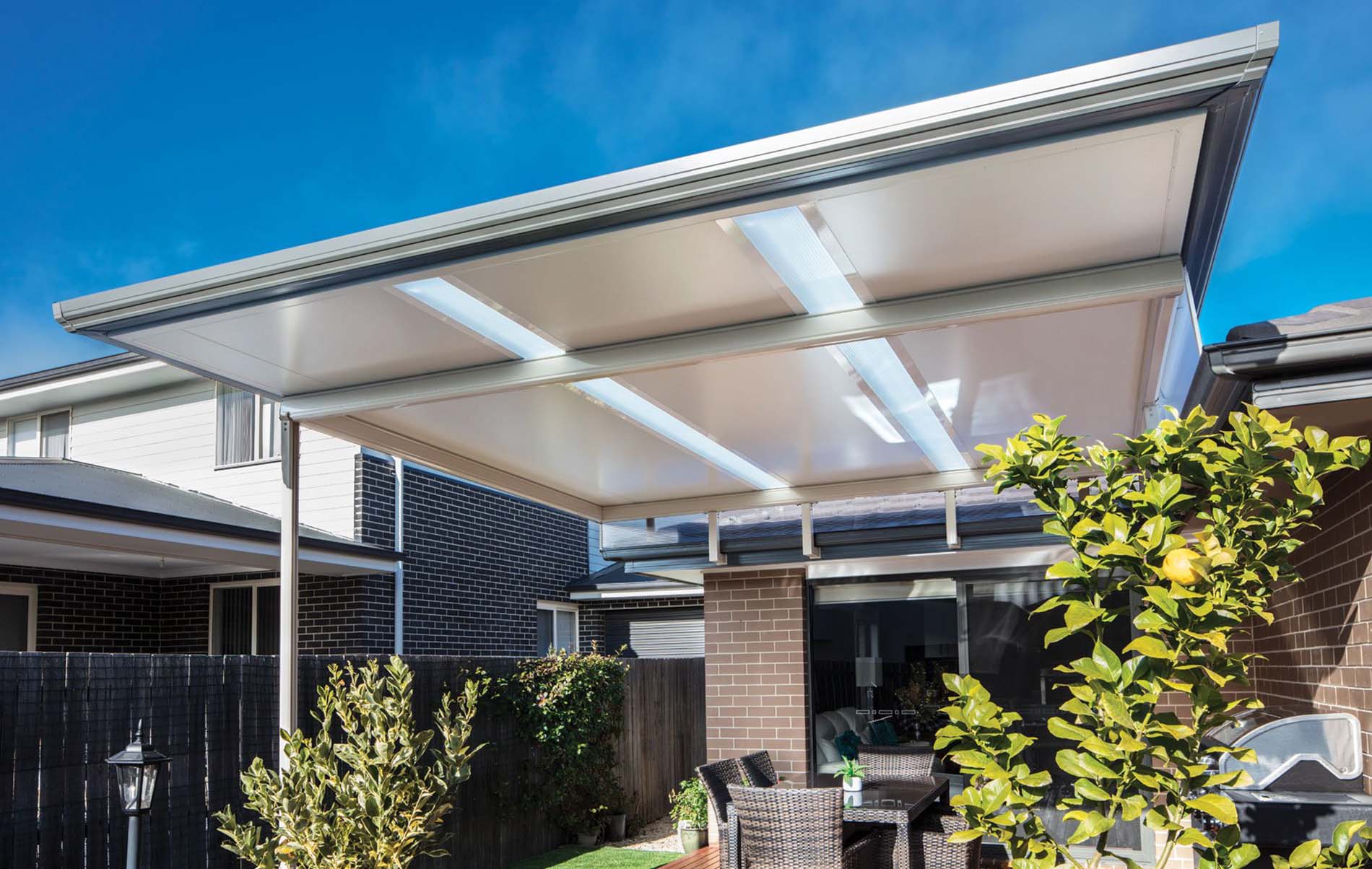 Elegant flat patio with concealed guttering and timber-look aluminium posts