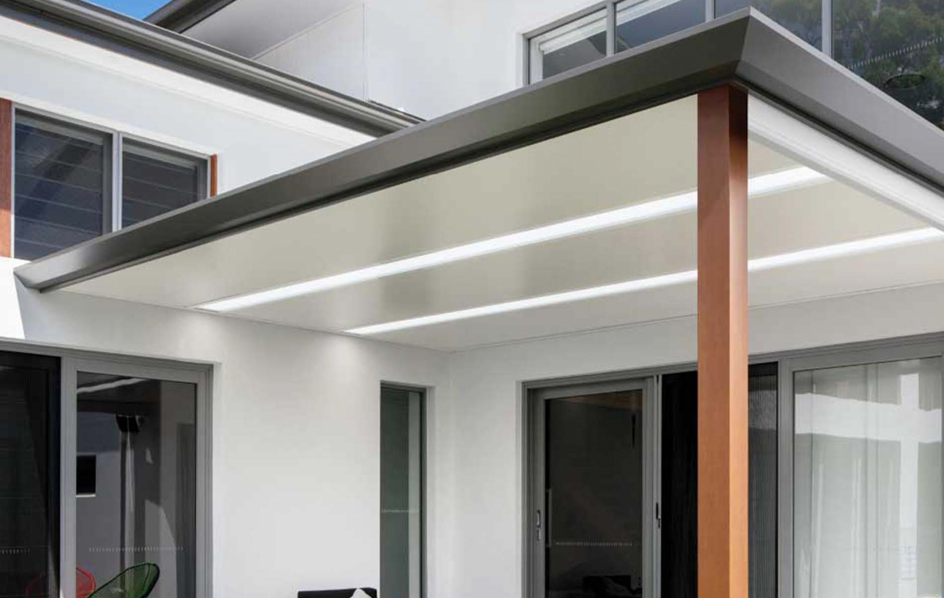 Modern flat roof patio featuring Stratco Cooldek insulated roofing panels, providing a sleek and contemporary outdoor living space.