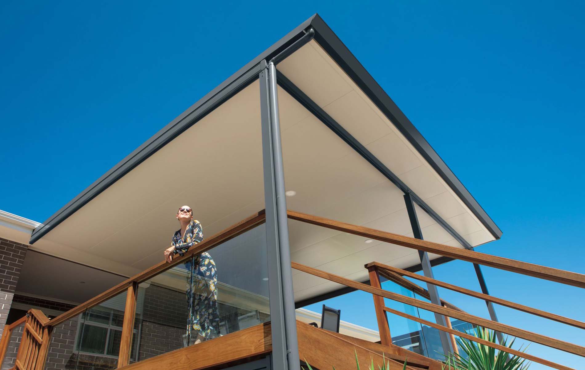 Underneath view of Stratco Cooldek flat roof patio, highlighting the integrated ceiling finish and clean lines.