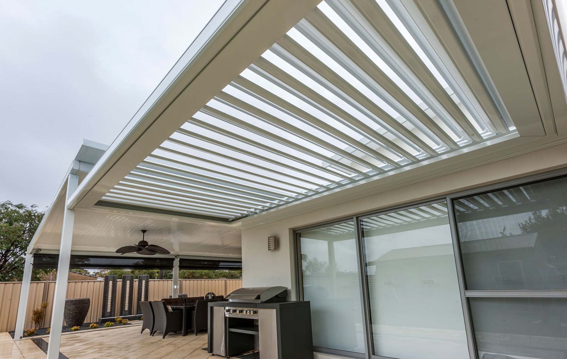 Contemporary louvre patio with timber-look aluminium frame and integrated lighting