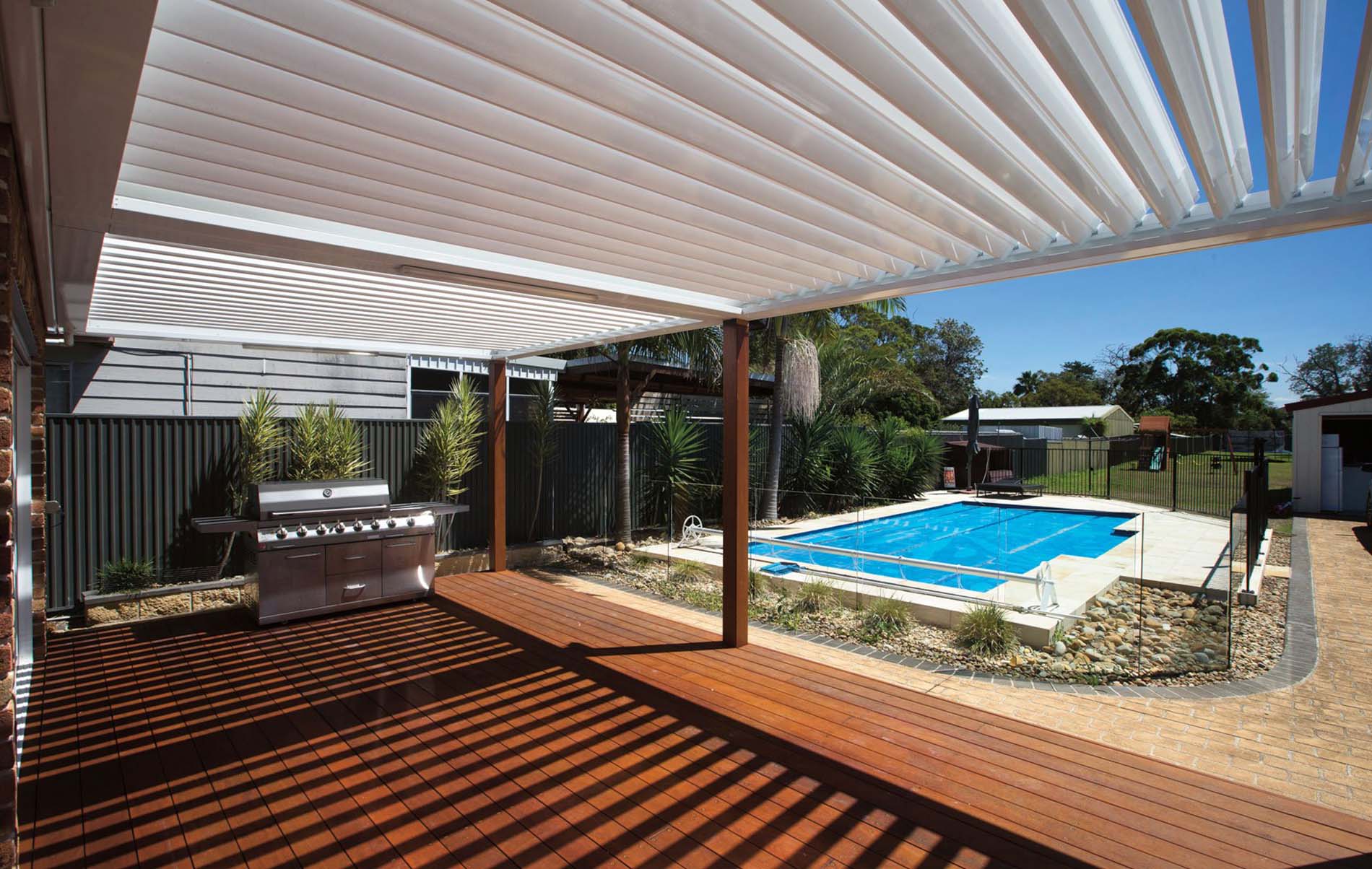 Modern outdoor louvre patio with adjustable slats and timber-look aluminium frame