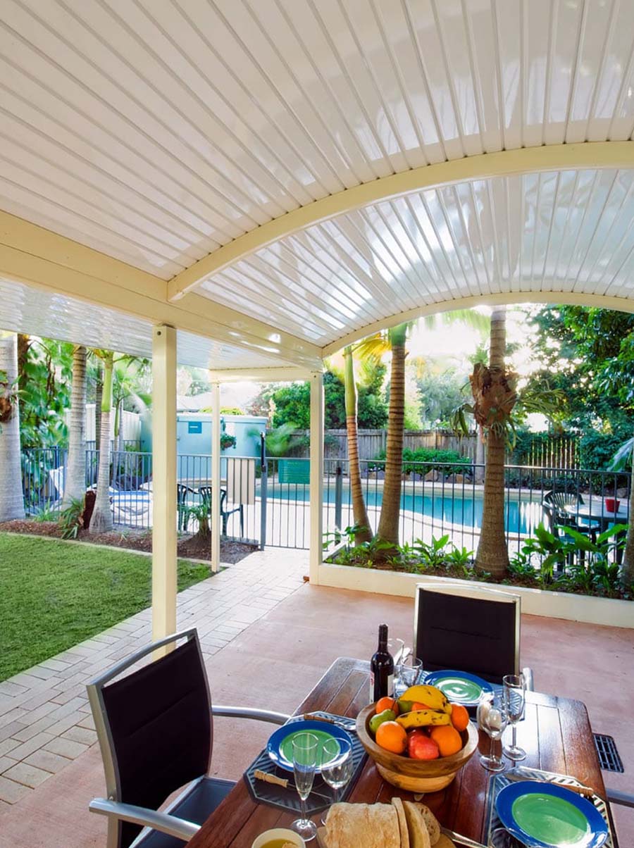 Curved verandah patio with ceiling fan and comfortable outdoor seating