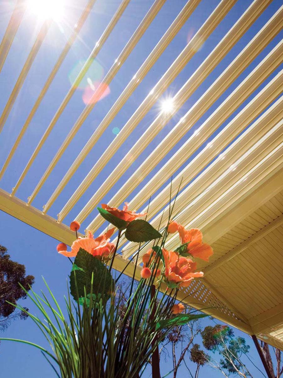 Spacious alfresco space enhanced by a high-tech Stratco louvre roof and subtle lighting