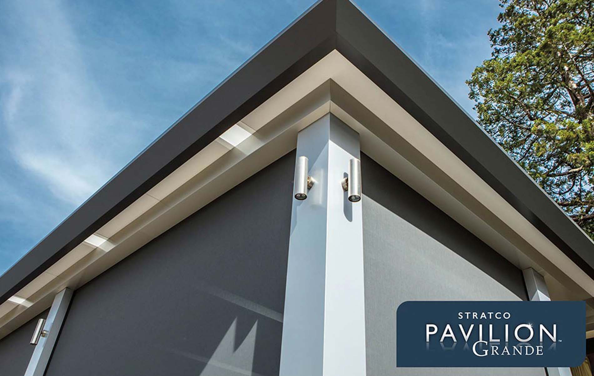 Stylish verandah featuring a louvre roof system, timber decking, and modern seating, enhancing the outdoor living experience.